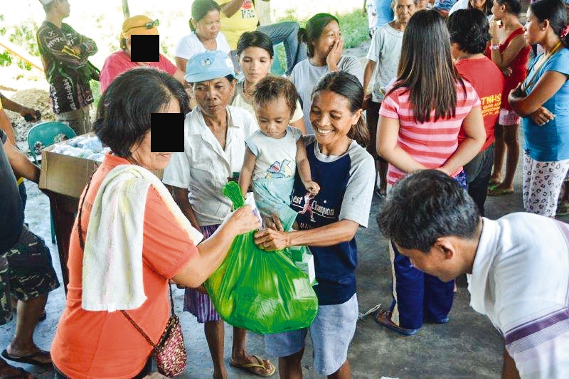 a mother and son getting the supplies they need 